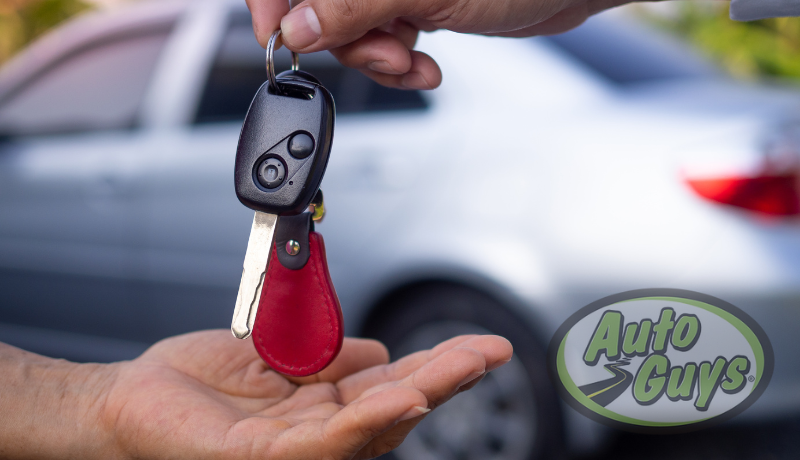 Customer receiving keys after leasing or purchasing a vehicle